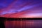 Colorful sunset on the lake. Romantic landscape with dramatic sky.