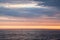 Colorful sunset over Baltic Sea, cloudy sky
