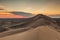 Colorful sunset over the dunes of the Gobi Desert.