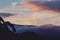 Colorful sunset over Mount Wellington in Tasmania, Australia with pink and purple clouds over the mountain and gum trees and