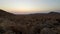 Colorful sunset over the Namib desert, Aus, Namibia, Africa. Clear sky, glowing rocks and hills, time lapse video