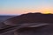 Colorful sunset over the Namib desert, Namibia, Africa. Scenic sand dunes in backlight in the Namib Naukluft National Park