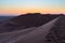 Colorful sunset over the Namib desert, Namibia, Africa. Scenic sand dunes in backlight in the Namib Naukluft National Park