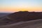 Colorful sunset over the Namib desert, Namibia, Africa. Scenic sand dunes in backlight in the Namib Naukluft National Park