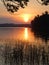 A colorful sunset over a peaceful lake