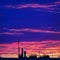 Colorful Sunset over the Urban Rooftop with Cable Wires and TV Antennas