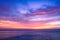 Colorful sunset sky over the ocean with dramatic clouds