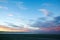 Colorful sunset sky with overcast clouds at Wharariki Beach, Nelson