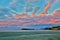 Colorful sunset sky with overcast clouds at Wharariki Beach, Nelson