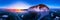 Colorful sunset on winter lake Baikal near an island covered with ice. . Cylindrical panorama 360