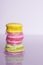 Colorful sweet french macaroons background for text