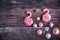 Colorful sweet homemade meringues in the form of a flamingo on wooden background. Many sweet zephyrs. Trendy top view