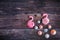Colorful sweet homemade meringues in the form of a flamingo on wooden background. Many sweet zephyrs. Trendy top view