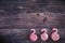 Colorful sweet homemade meringues in the form of a flamingo on wooden background. Many sweet zephyrs. Trendy top view