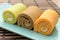 Colorful swiss roll on green dish