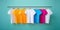 colorful t-shirts hanging. Rainbow colors, clothes on wooden hangers. Blank collared shirt mock up template, plain t-shirt mockup
