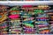 Colorful tailor supplies like ribbons and embroidery material in a street shop in the tailor market in Mumbai, India