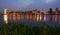 Colorful Taipei city lights reflecting in the Tamsui River at night in Taiwan