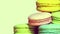 Colorful tasty macaroons rotating on the white background. Retro colors