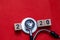 Colorful on text 2020 to 2021 banner for health care and Red heart love medical concept. black stethoscope,on table red background