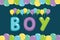 Colorful text boy with balloons. Color letters fly on balloons. Inscription from letters for Baby shower, card.