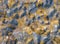 Colorful texture of mining spoil heaps at abandoned pyrite mine, view directly above