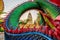 Colorful Thai Naga surrounding Sri Maha Pho Chedi stupa in the sunset at Wat Phra That Nong Bua