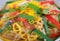 Colorful Thai rice noodles in dish ready to serve