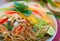 Colorful Thai rice noodles in dish ready to serve