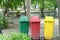 Colorful Three Recycle Bins In The Park