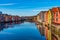 Colorful timber houses surrounding river Nidelva in the Brygge district of Trondheim, Norway