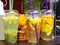 Colorful tonic cocktails on store counter on bright day