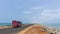 Colorful tourist bus on the road of Dhanushkodi between the sea, Rameswaram, Tamilnadu,