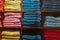 Colorful towel collection on a dark shelf in a textile store