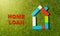 Colorful toy blocks house and tex Home Loan written on grass in banking and property Investment