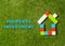 Colorful toy blocks house and text Property investment written on grass in housing market business