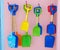 Colorful toy spades hanging on wall