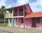 Colorful traditional Caribbean houses with pink and green facades. Tropical architecture and construction