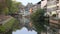Colorful traditional houses reflecting in river Ill in Strasbourg
