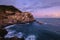 Colorful traditional houses on the rock over Mediterranean sea on dramatic sunset, Manarola, Cinque Terre, Italy