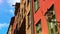 Colorful, traditional Italian houses and street with blue sky street.