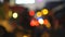 Colorful traffic lights bokeh circles on night city street. Abstract background