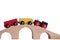 Colorful train toy on wooden bridge with white background