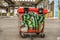 Colorful trash bin with graffiti in a large industrial hall