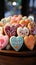 Colorful treats Heart shaped glazed cookies with floral designs on a wooden stand at a restaurant