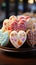Colorful treats Heart shaped glazed cookies with floral designs on a wooden stand at a restaurant