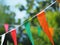 colorful triangular bunting flags and moving by wind on nature background for decorated celebrate party.