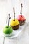 Colorful trio of candied apples for Halloween