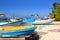 Colorful tropical boats beached in sand