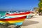 Colorful tropical boats in sand Isla Mujeres